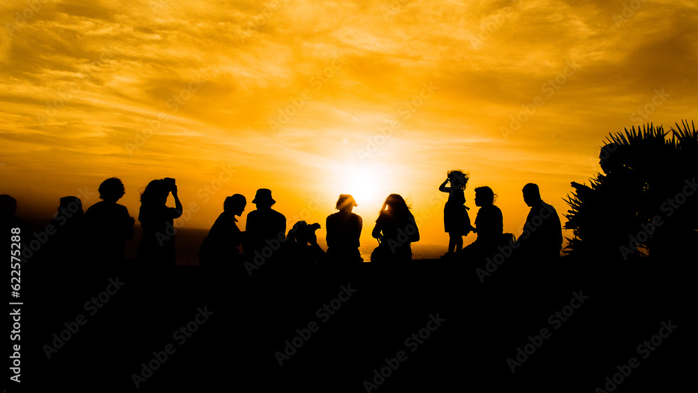 Silhouette many people looking sunset at view point. That is cloudy sky and lighting with the sky. Holiday happiness concept.Family time. Silhouette many people looking sunset at view point. That is cloudy sky and lighting with the sky. Holiday happiness concept.Family time.