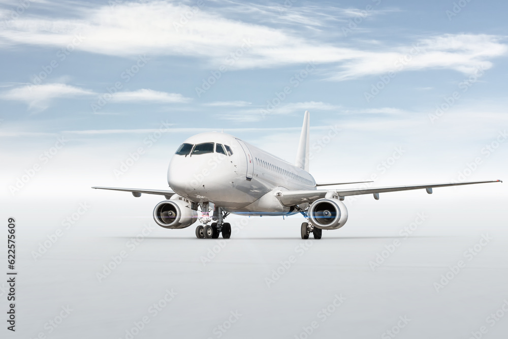 White passenger aircraft isolated on bright background with sky White passenger aircraft isolated on bright background with sky