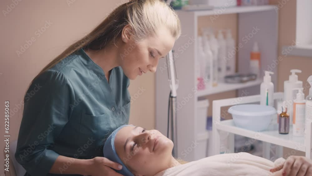 Cosmetologist checking clients skin condition after dermatitis treatment course Cosmetologist checking clients skin condition after dermatitis treatment course