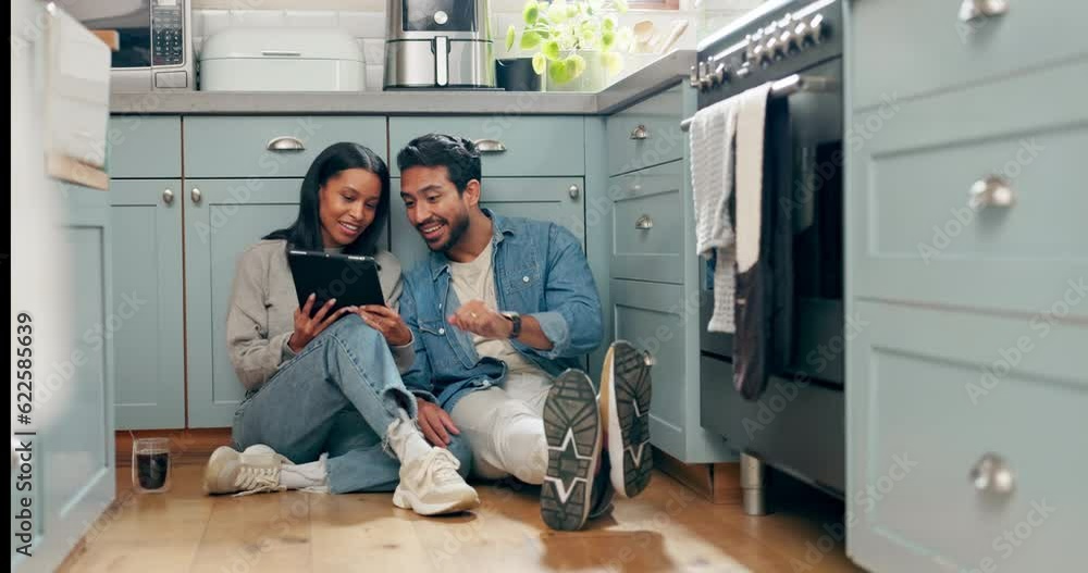 New house, renovation and couple with digital tablet on a kitchen floor for idea, search or inspiration. Real estate, property and man with woman online for creative, planning and interior design