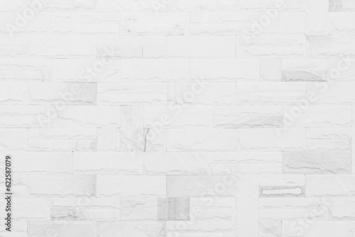White brick wall texture background in room at subway. Brickwork stonework interior  rock old concrete grid uneven abstract weathered grey clean tile design.