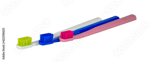 New toothbrushes - red  white and blue - isolated - side view