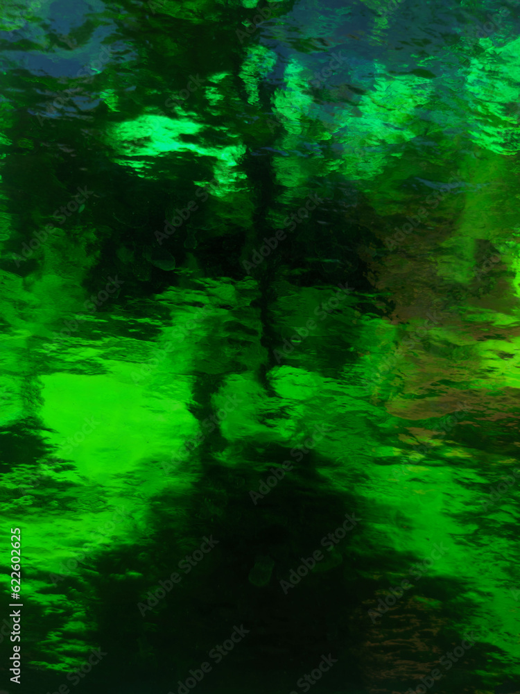 green glass. abstract blurred background.