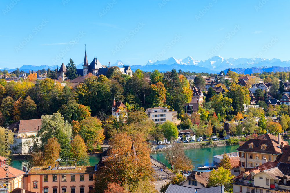 View of Bern city and the Bern History Museum at autumn with the Swiss Alps in the background