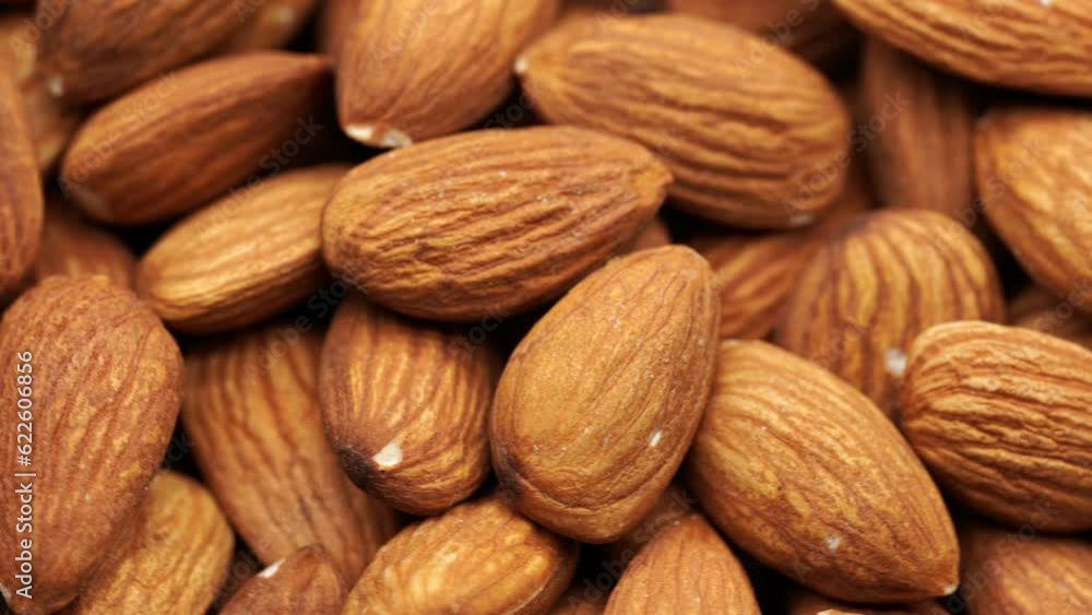 Almond nuts close up rotate in a circle. Nut almond close up. product rich in minerals and vitamins. Almond kernels rotating. A rotating shot of almonds. Texture of Almond kernels. Almond nuts close up rotate in a circle. Nut almond close up. product rich in minerals and vitamins. Almond kernels rotating. A rotating shot of almonds. Texture of Almond kernels.