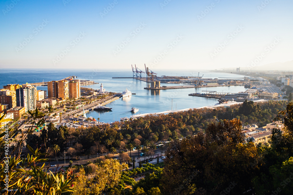 Obraz premium view over Malaga at sunset travel banner