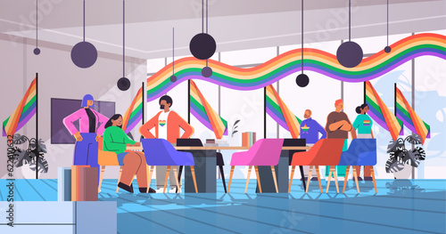 mix race businesspeople with lgbt rainbow flags gay lesbian love parade pride festival transgender love concept