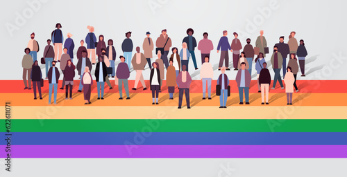 mix race people crowd standing together on lgbt rainbow flag gay lesbian love parade pride festival transgender love concept