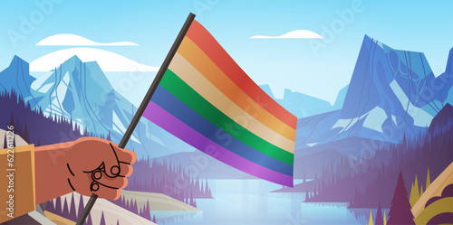 human hand holding lgbt rainbow flag gay lesbian love parade pride festival transgender love concept