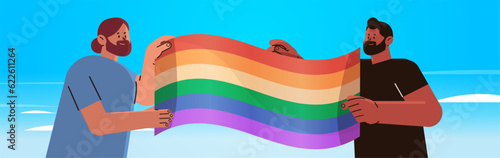 men holding lgbt rainbow flag gay lesbian love parade pride festival transgender love concept horizontal