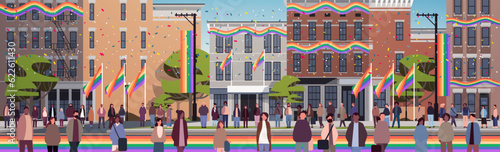 mix race people with lgbt rainbow flags walking city street gay lesbian love parade pride festival transgender love concept