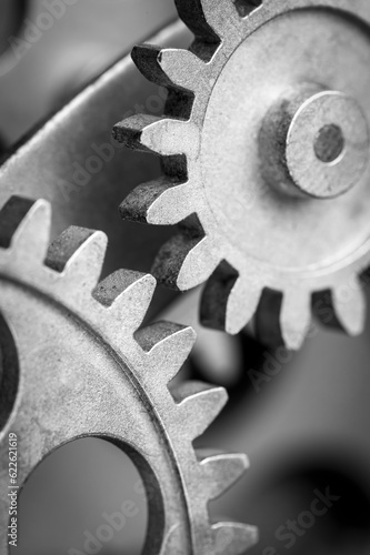 Close view of old clock mechanism with gears and cogs. Conceptual photo for your successful business design. Copy space included.