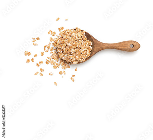 Spelled flakes in wooden spoon on wooden background