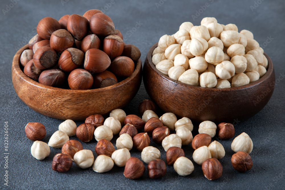 Heap of peeled and shelled hazelnuts on dark background Heap of peeled and shelled hazelnuts on dark background