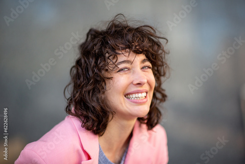 Beautiful young caucasian woman smiling cheerfully