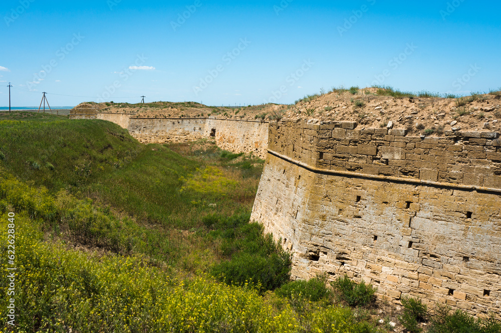 Fototapeta premium Moat and ruins of the Tatar-Turkish fortress Arabat on the Azov coast of Crimea