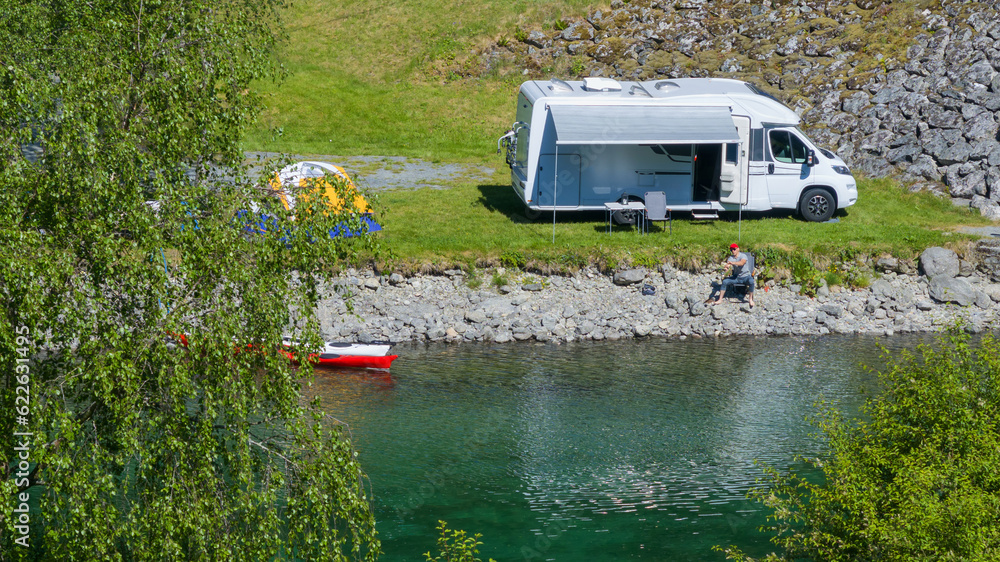 Riverfront RV Camper Van Camping with Tent and Kayaks