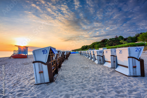 Fototapeta Naklejka Na Ścianę i Meble -  Beautiful sunrise on the summer beach at Baltic Sea in Ustka, Poland.