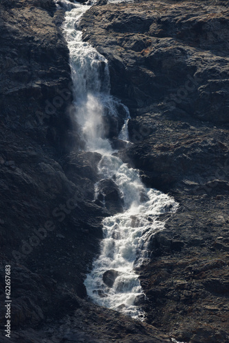 a sign of climate change. waterfall of meltwater at Triftgletscher, Berner Oberland