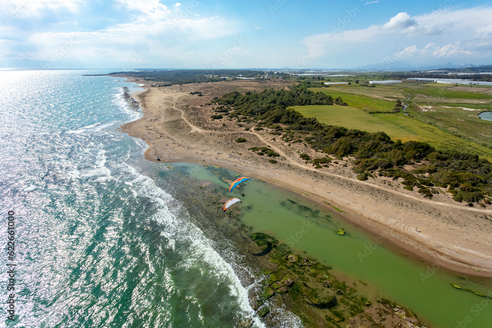 Aerial view of paramotors flying, Mediterranean coast, Belek, Antalya, Turkey. Aerial view of paramotors flying, Mediterranean coast, Belek, Antalya, Turkey.