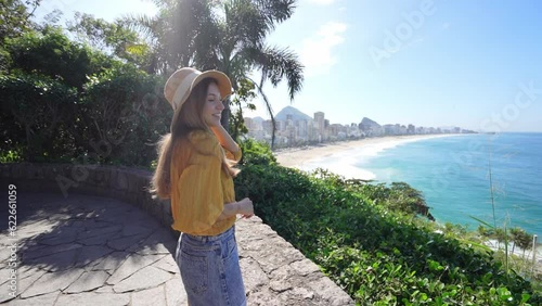 Stylish smiling tourist woman on viewpoint in Rio de Janeiro, Brazil photo