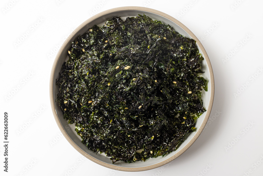 Seasoned, dried and grilled seaweedflake on a white background Seasoned, dried and grilled seaweedflake on a white background