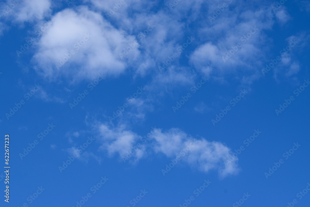 Bright blue sky with white clouds natural background Bright blue sky with white clouds natural background
