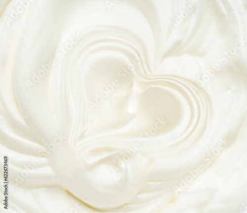 Waves of white eggs cream  dairy yogurt close-up.