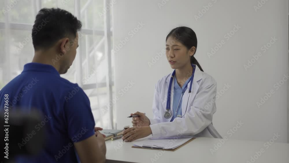 Beautiful young asian female doctor giving advice to male patient in hospital office. Healthcare concept, Female doctor give advice and writing prescription to patient in clinic. Beautiful young asian female doctor giving advice to male patient in hospital office. Healthcare concept, Female doctor give advice and writing prescription to patient in clinic.