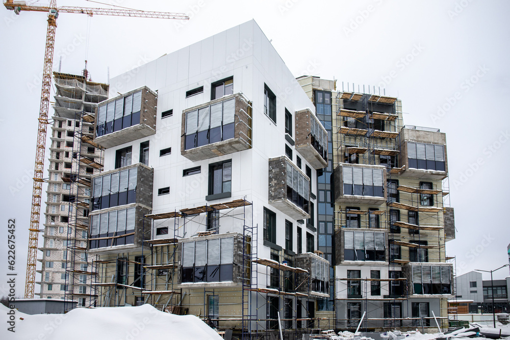 installation of thermal insulation of the facade of an apartment house ...