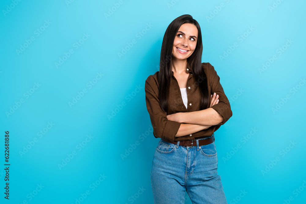Portrait of nice lady holding folded arms confident specialist looking side empty space shop banner isolated blue color background Portrait of nice lady holding folded arms confident specialist looking side empty space shop banner isolated blue color background