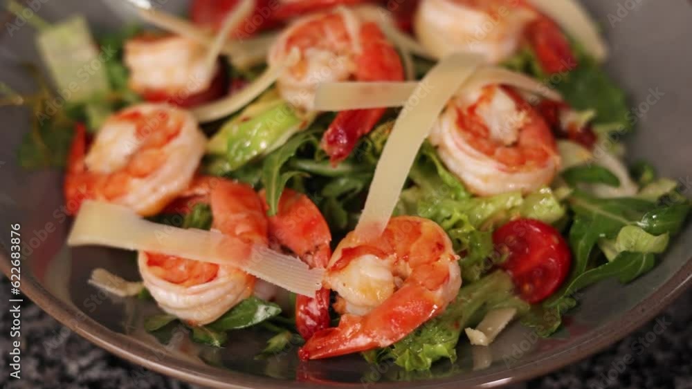 A chef cooks a dish with shrimp A chef cooks a dish with shrimp