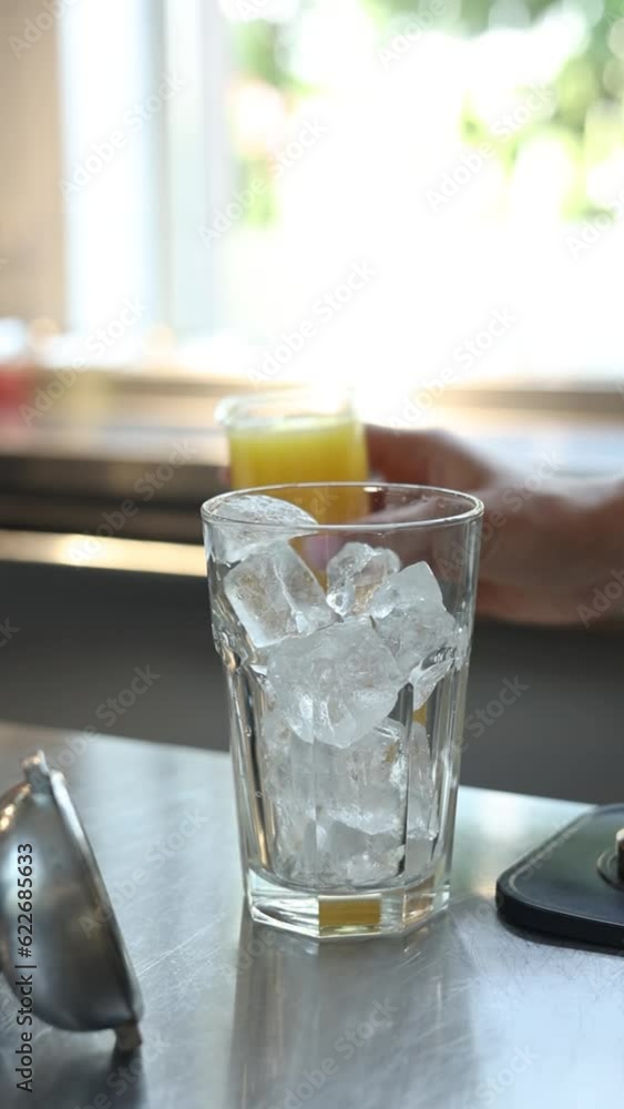 A girl prepares drinks at a bar A girl prepares drinks at a bar