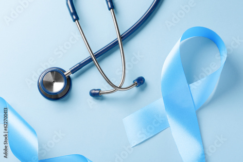 Blue awareness ribbon with stethoscope, world diabetes day on light background