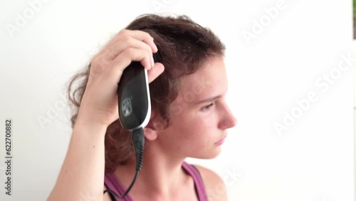 Teenage girl shaves head baldly photo