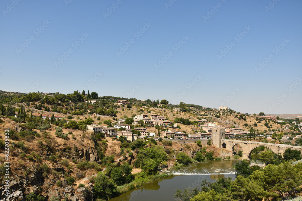 Scenic view of the river and old town of Toledo, Spain on a sunny day