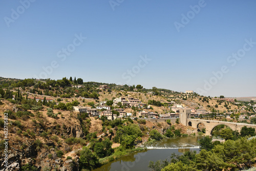 Scenic view of the river and old town of Toledo, Spain on a sunny day