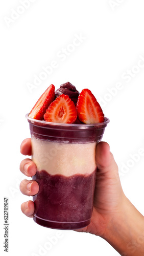 Hand holding a cup of açaí 