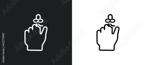 hand finger with a ribbon outline icon in white and black colors. hand finger with a ribbon flat vector icon from human body parts collection for web, mobile apps and ui.