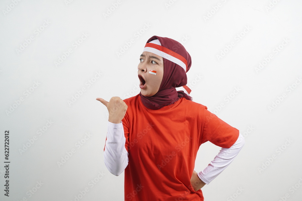 Woman pointing something - indonesian independence day concept Woman pointing something - indonesian independence day concept