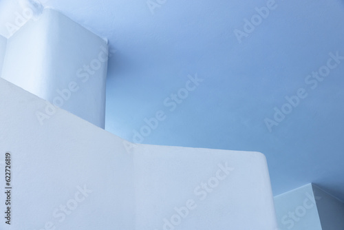 Blue minimal interior fragment with ceiling, wall and pillar