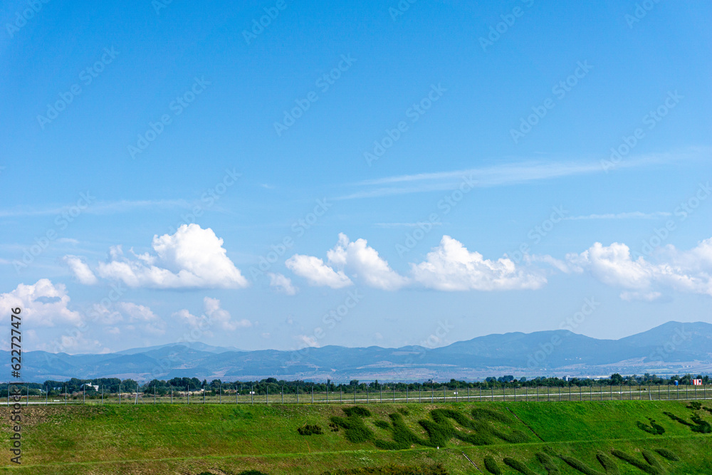 Landscape with blue sky and clouds