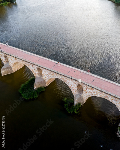 Wallpaper Mural Aerial view of an old stone bridge crossing the Douro river in Zamora, Spain. Torontodigital.ca