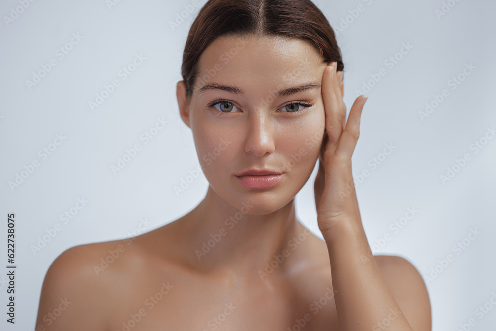Anti Aging Treatment and Facelift Skin Care Concept. Woman with hand on cheek and eye Anti Aging Treatment and Facelift Skin Care Concept. Woman with hand on cheek and eye