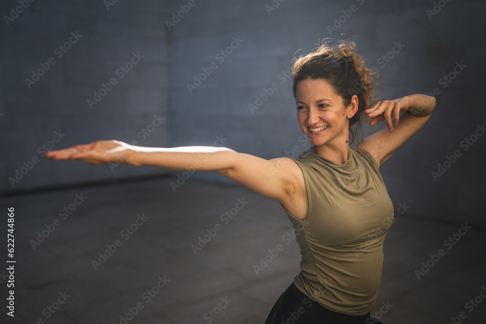 One adult caucasian woman stretch yoga practice in summer day outdoor