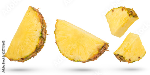 Ripe pineapple slices on a white isolated background. Pineapples of different ways of cutting. Pineapple isolate with remnants of peel of various shapes. To be inserted into a design or project.