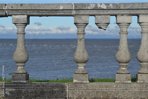 Stone balustrade on the seashore with sea in the background