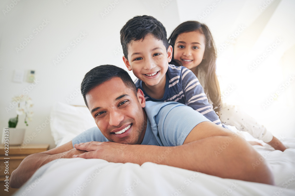 Family, portrait and play with fun and smile in a home with bonding and parent care. Happy, house and bedroom with a father and young children together in the morning with dad and kids with youth Family, portrait and play with fun and smile in a home with bonding and parent care. Happy, house and bedroom with a father and young children together in the morning with dad and kids with youth
