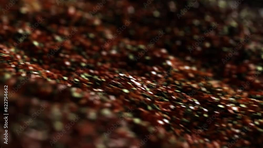 Stockvideon Luxurious flow of particles on a dark background. Quicksand