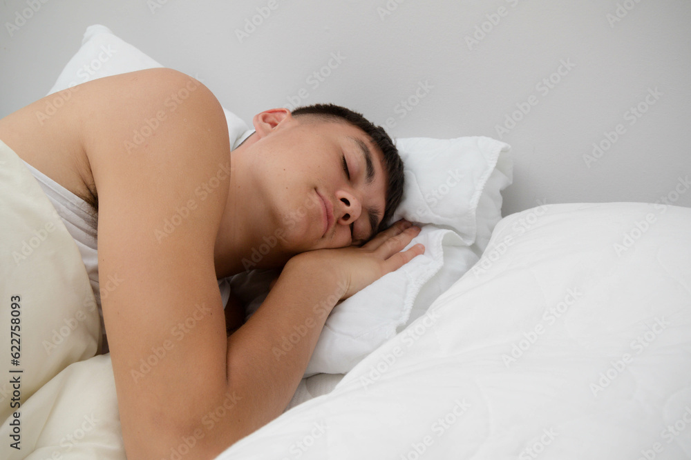 Young Man Sleeping in Bed Young Man Sleeping in Bed